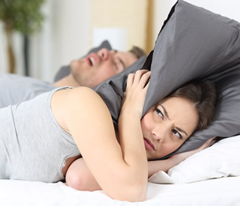 What causes sleep apnea skowhegan Me - Man snoring and his wife covering ears